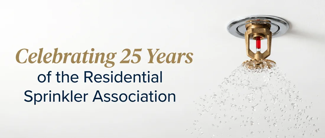  RSA-25-Years.webp: "Fire sprinkler head spraying water with text celebrating 25 years of the Residential Sprinkler 